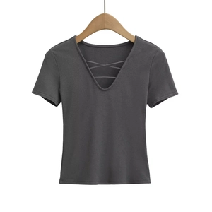 Detail of dark grey V-neck top featuring trendy cross-lace straps and knit texture