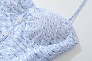 Detail of light blue striped French dress with front buttons and built-in bra pads