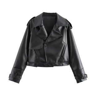 Detail of cropped black PU leather jacket showing lapels, button and belt buckle texture