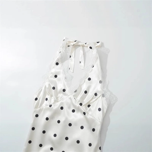 Off-white satin halter top with black polka dots and lace trim neck detailing