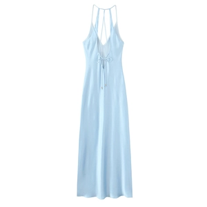 Detail of light blue satin midi dress featuring crisscross tie-back and bow closure