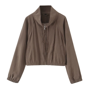 Detail of mocha brown windproof jacket with stand-up collar and smooth metallic zipper