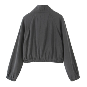 Back view of a charcoal gray cropped windbreaker jacket with elastic hem and cuffs