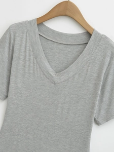 Detail of grey V-neck short sleeve cotton t-shirt on wooden hanger with clean texture