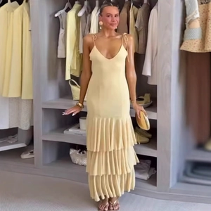 Elegant light yellow tiered maxi dress with V-neck and ruffled hem for women