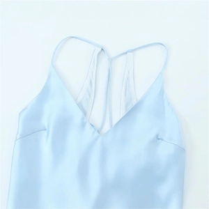 Light blue satin lingerie-style midi dress with thin straps and V-neckline flat lay view