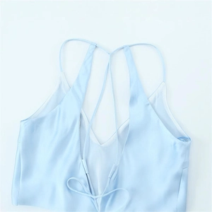 Light blue silk midi dress featuring a backless design with delicate lace-up bow detail
