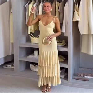 Fashionable pale yellow tiered maxi dress with fringes and spaghetti straps for women