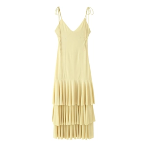 Elegant light yellow tiered fringe maxi dress with spaghetti straps and a deep V-neckline