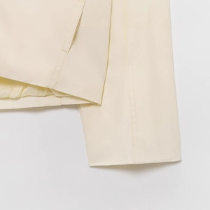 Minimalist beige bomber jacket for women featuring premium twill texture and fine stitching