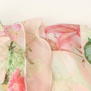 Women's pink floral chiffon blouse featuring tiered ruffle layers and overlock edges