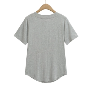 Detail of grey short-sleeve T-shirt featuring a crew neck and curved hem on a hanger