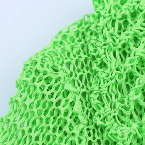 Knitted fluorescent green mesh cardigan detail with diamond grid crochet pattern