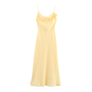 Detail of light yellow cowl neck dress featuring delicate wavy texture on satin fabric