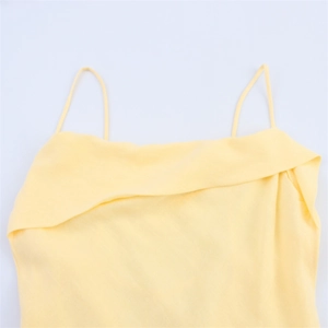 Detail view of light yellow ramie-blend top with thin straps and draped cowl neckline