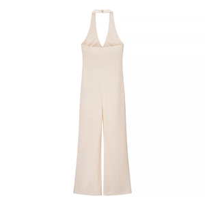 Detail view of apricot halter neck wide-leg jumpsuit with elegant back buckle design