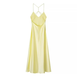Elegant pale yellow satin midi slip dress with thin cross straps and deep V-back