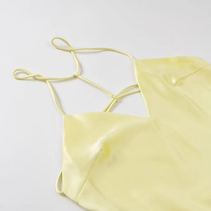 Elegant light yellow satin midi slip dress with back lace-up straps and silky finish