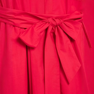 Red poplin dress for women featuring a stylish waist tie with a large decorative bow detail