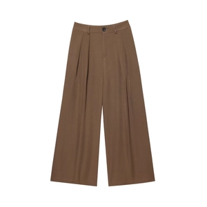 Detail shot of brown wide-leg trousers featuring high waist design and pleated front details