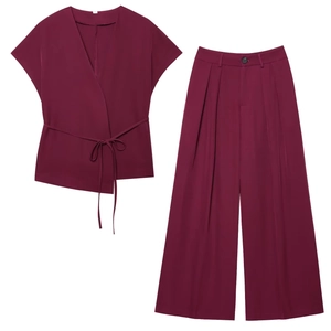 Women's two-piece wine red set featuring short sleeve wrap top and wide-leg trousers