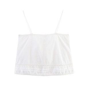 Flat lay of white spaghetti strap camisole featuring delicate lace trim details