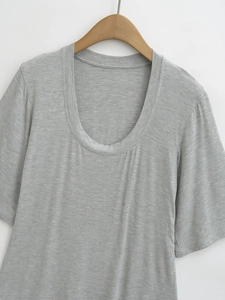 Close-up of gray crew neck cotton tee showing soft marl texture and premium knit detail