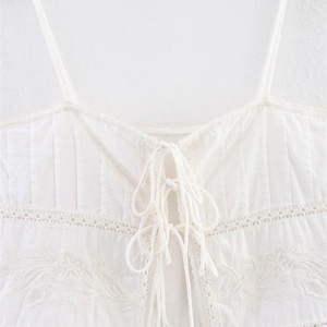 White minimalist camisole top with floral embroidery and lace trim details