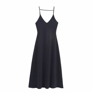 Detail of the V-neckline and delicate spaghetti straps on this polka dot maxi dress