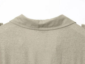 Detailed close-up of light khaki linen midi dress collar with clean stitching texture