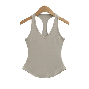 Detail of light khaki ribbed knit tank top with V-neck and stylish curved hemline