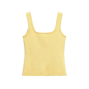 Detailed close-up of pale yellow knit camisole with square neck and ribbed texture