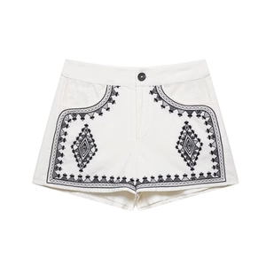 Women's white cotton shorts featuring ethnic black geometric embroidery and mid-waist fit