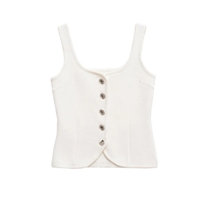 Detail of white knit vest top with deep round neck and five silver metallic buttons