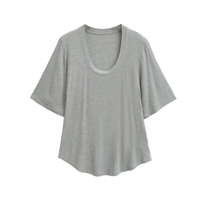 Minimalist grey T-shirt with deep U-neckline and curved hem shown in a flat lay view