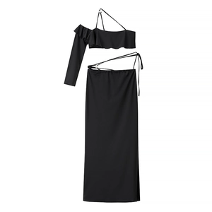 Sexy black two-piece set featuring off-shoulder ruffle top and high slit maxi skirt