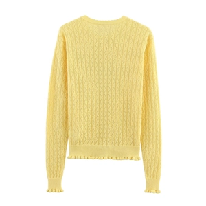 Detailed back view of bright yellow knit sweater with hollow diamond texture and ruffled hems