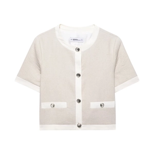 Detailed front view of a beige linen blend short sleeve jacket with contrast trim