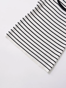 Detailed view of the fine ribbed knit texture on a black and white striped tank top
