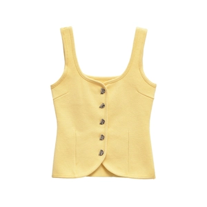 Bright yellow waffle knit vest with decorative vintage buttons and U-neckline