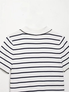 Detailed view of striped knit top with scalloped mock neck and short sleeves
