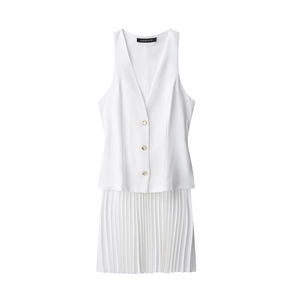 Detail of white sleeveless mini dress with golden buttons and pleated skirt texture