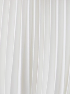 Close-up of white pleated chiffon fabric showing fine vertical texture and soft drapes
