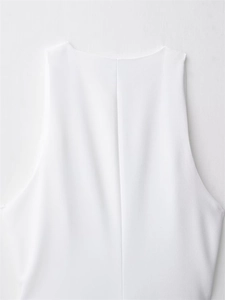 Close-up of white mini dress neckline and back seam detail with fine fabric texture