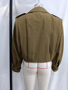 Rear view of khaki short jacket featuring broad shoulders and deep back pleat detail