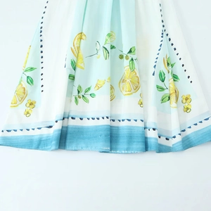 Women's light mint green poplin summer dress featuring vibrant lemon and leaf prints