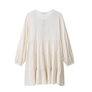 Elegant off-white long sleeve tiered cake dress with delicate embroidery stitching