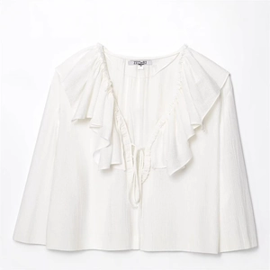 Elegant white long sleeve blouse featuring a deep V-neckline and layered ruffle trim accents