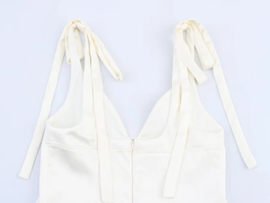 Detail of cream white camisole with adjustable bow ribbon straps and hidden back zipper