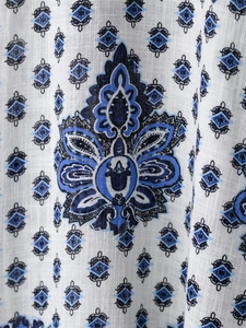Macro detail of bohemian paisley floral print on breathable cotton linen fabric
